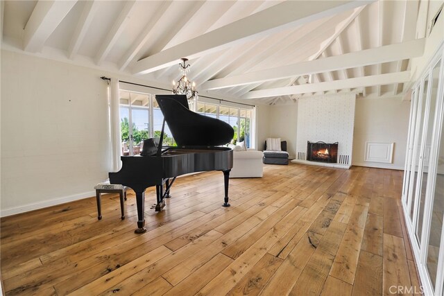 8 Quail Ridge Rd S, Rolling Hills, CA 90274 - living area featuring light wood-style floors, a chandelier, and a brick fireplace