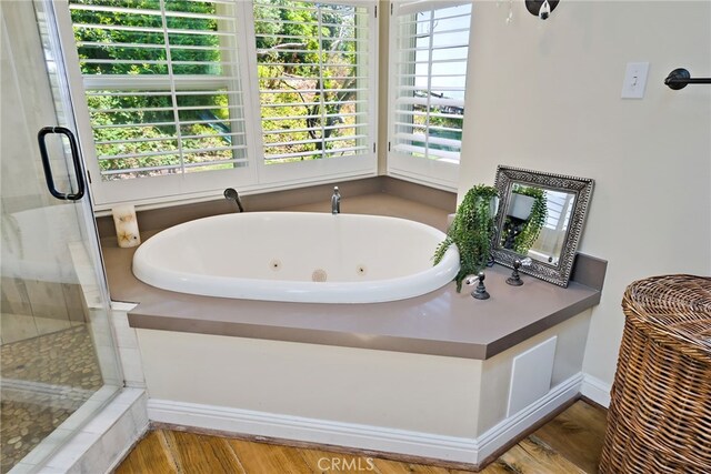 8 Quail Ridge Rd S, Rolling Hills, CA 90274 - full bath featuring a shower stall, a jetted tub, and wood finished floors