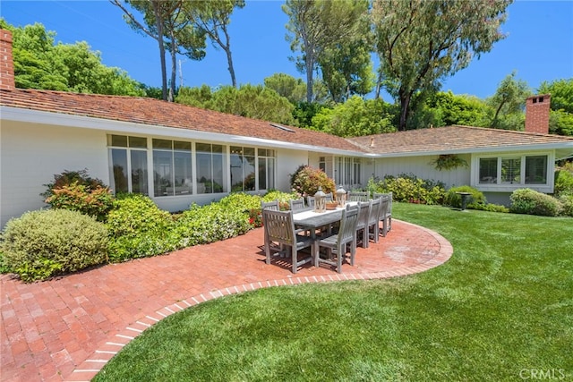 8 Quail Ridge Rd S, Rolling Hills, CA 90274 - back of house featuring a chimney, a patio, and a yard