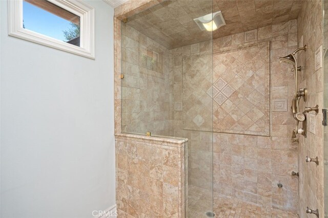 bathroom with tiled shower