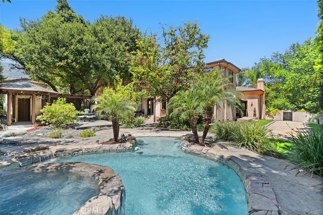 view of swimming pool featuring a patio area