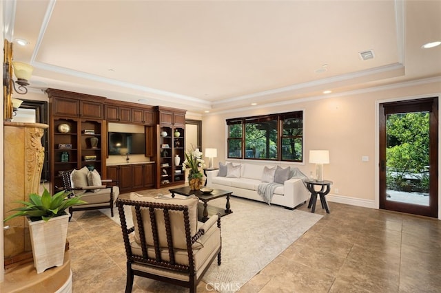 living room featuring a raised ceiling and crown molding