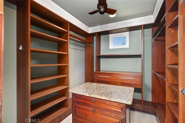 spacious closet with ceiling fan