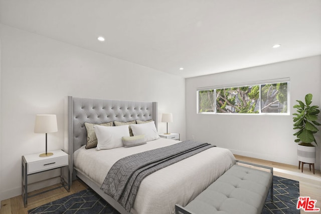 bedroom with wood-type flooring