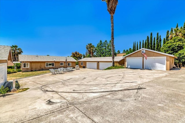 ranch-style home featuring a garage