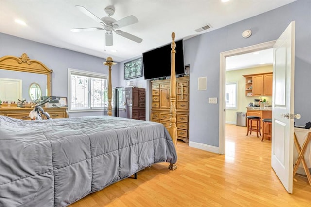 bedroom featuring light wood-type flooring and ceiling fan