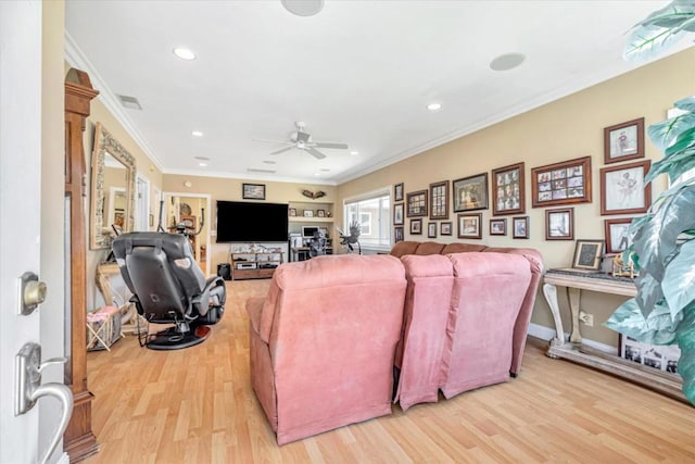 living room with ceiling fan, hardwood / wood-style floors, and ornamental molding