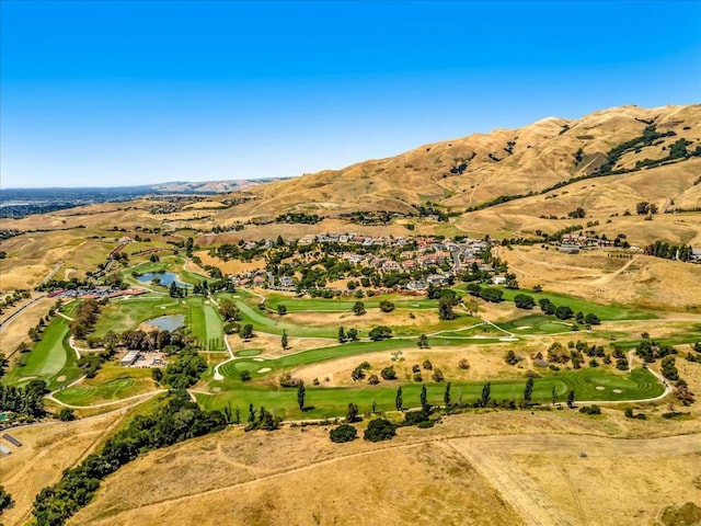 drone / aerial view featuring a water and mountain view