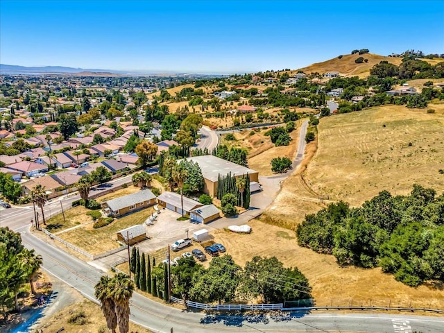 birds eye view of property featuring a mountain view