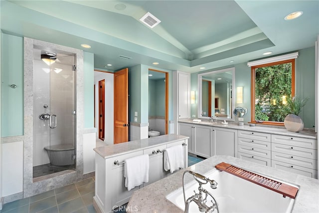 bathroom featuring lofted ceiling, visible vents, a stall shower, vanity, and tile patterned floors