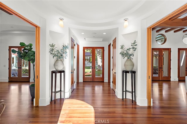 entryway with french doors, baseboards, and wood finished floors