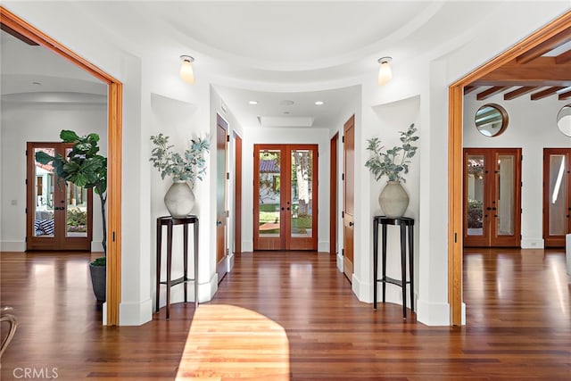 foyer entrance with french doors, baseboards, and wood finished floors