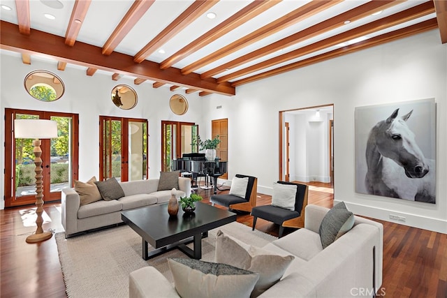 living area with wood finished floors, beam ceiling, and recessed lighting