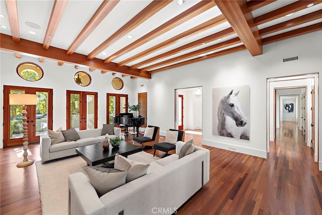 living area with french doors, beam ceiling, wood finished floors, and visible vents