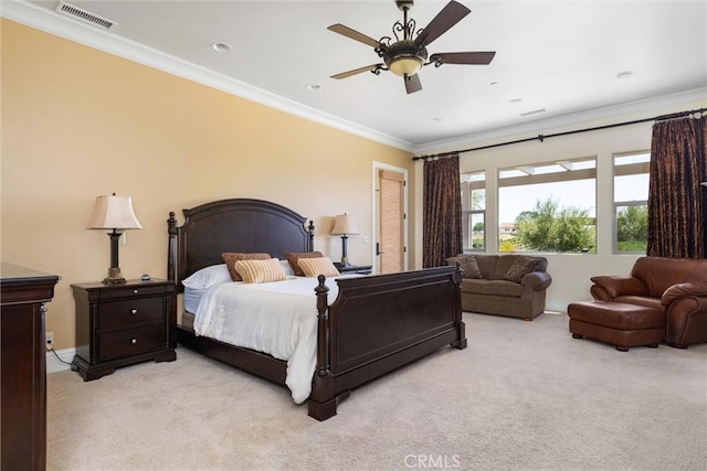 bedroom with a ceiling fan, visible vents, crown molding, and light colored carpet