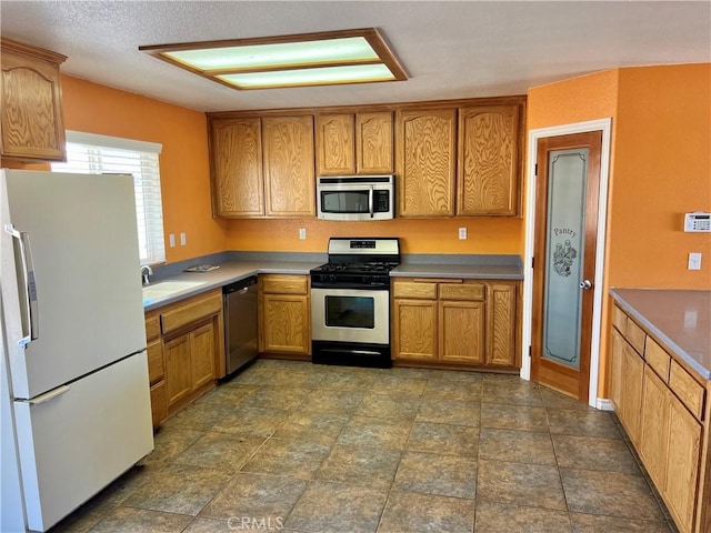 kitchen featuring stainless steel appliances and sink