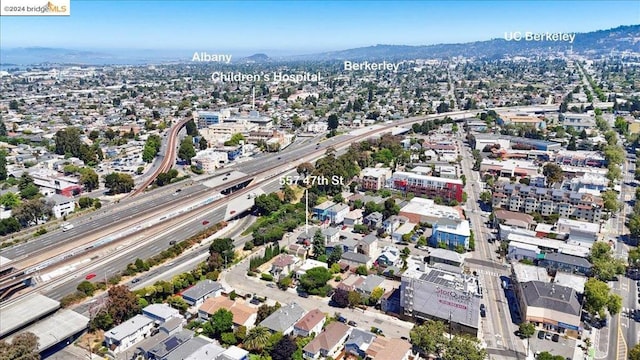 birds eye view of property with a mountain view