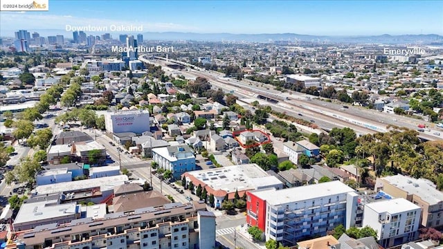 birds eye view of property with a mountain view