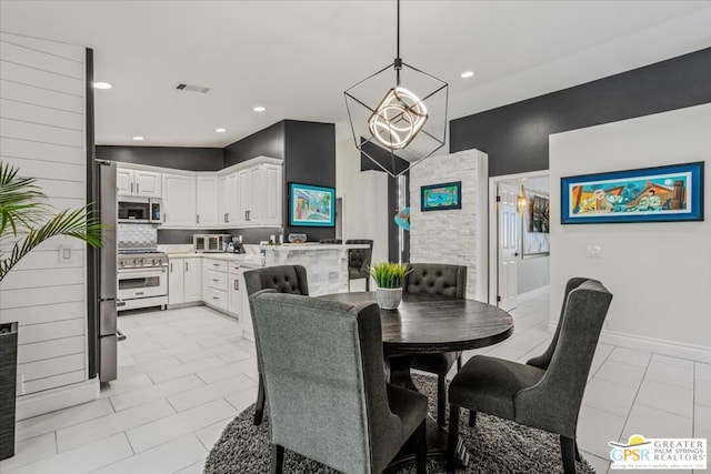 dining area featuring light tile patterned floors