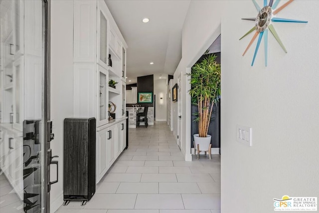 hallway with light tile patterned flooring