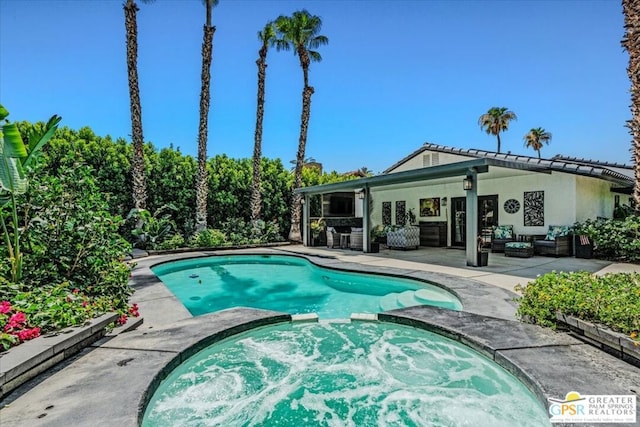 view of pool with a patio, an outdoor living space, and an in ground hot tub