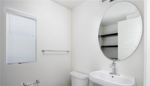 bathroom with toilet and sink