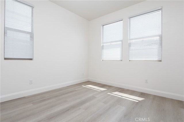 unfurnished room featuring light wood-type flooring