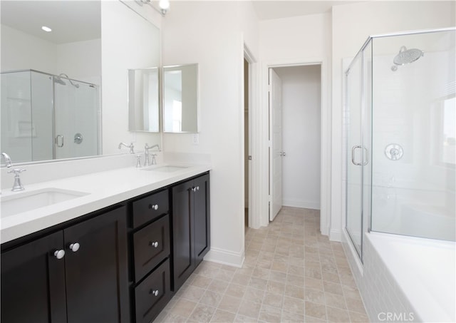 bathroom featuring vanity and a shower with shower door