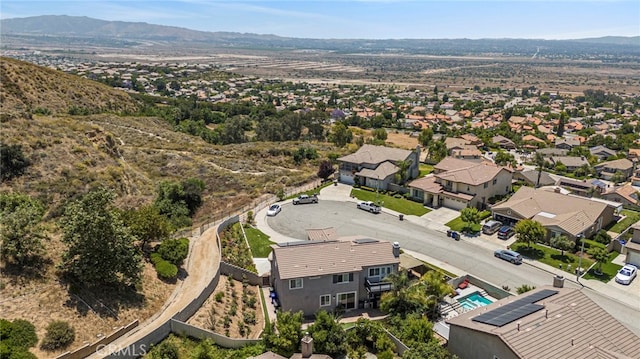 birds eye view of property with a mountain view