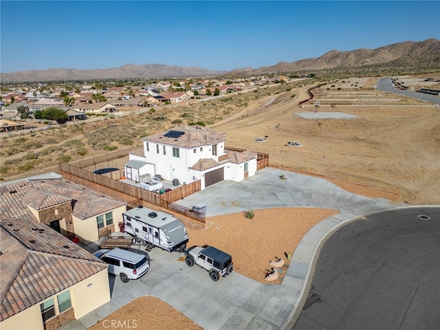 drone / aerial view featuring a mountain view