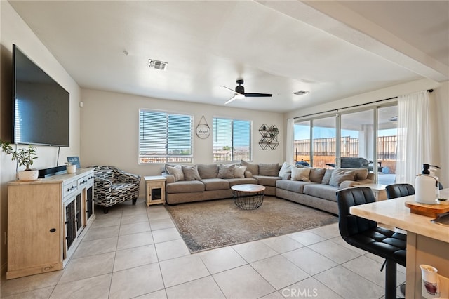 tiled living room with ceiling fan