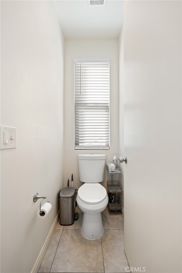 bathroom with tile patterned floors and toilet