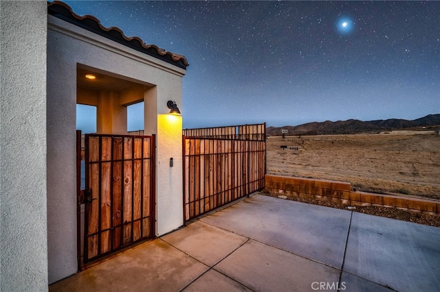 view of patio / terrace with a mountain view