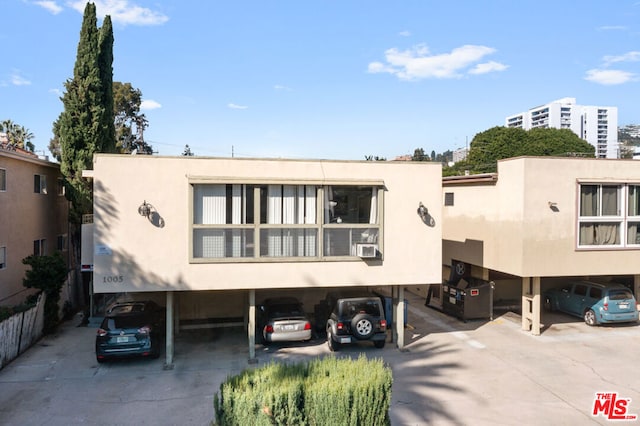 view of front facade with a carport