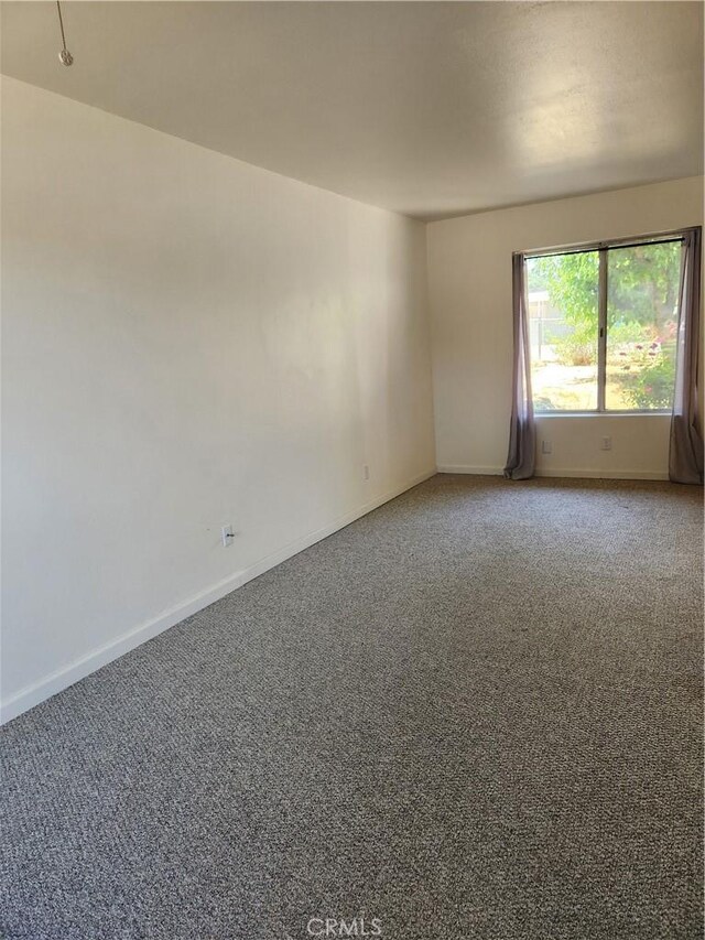 spare room featuring carpet