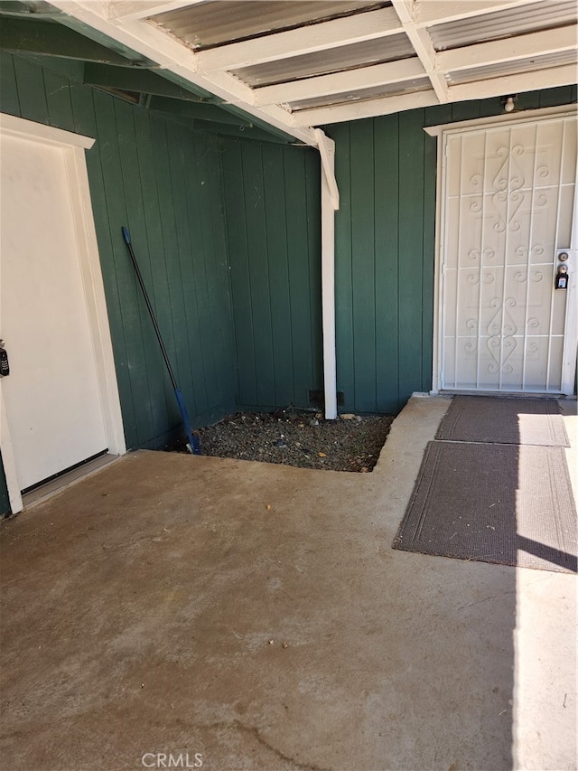 entrance to property with a patio