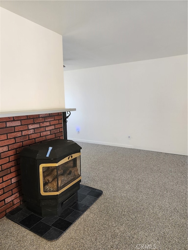 interior details with carpet flooring and a wood stove