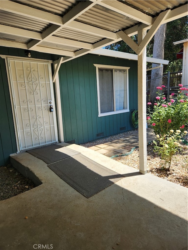 property entrance with a patio