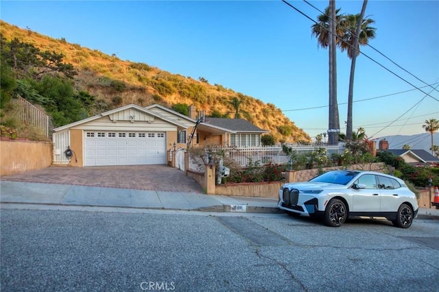 ranch-style house with a mountain view and a garage