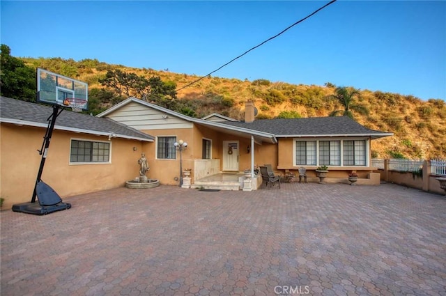 back of property with a patio area