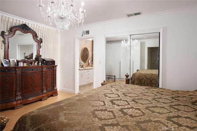 bedroom featuring ensuite bathroom, a closet, crown molding, and light hardwood / wood-style flooring