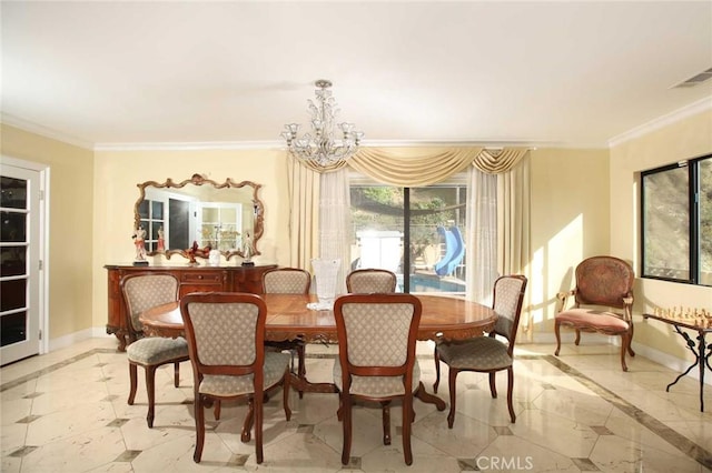 dining space with ornamental molding and a chandelier