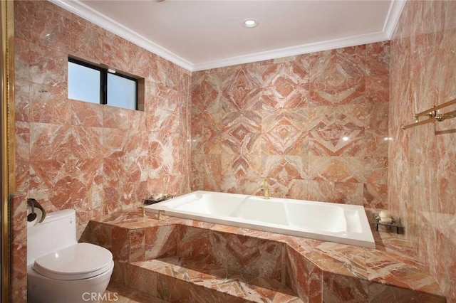 bathroom featuring toilet, crown molding, tile walls, and tiled tub