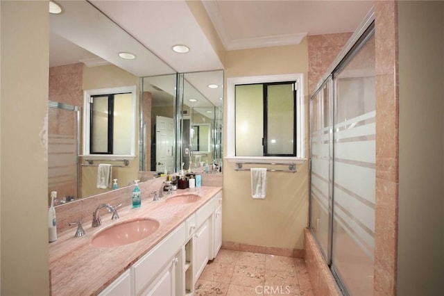 bathroom featuring crown molding and vanity