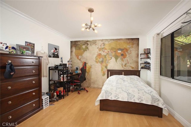 bedroom featuring light hardwood / wood-style flooring, ornamental molding, and a notable chandelier