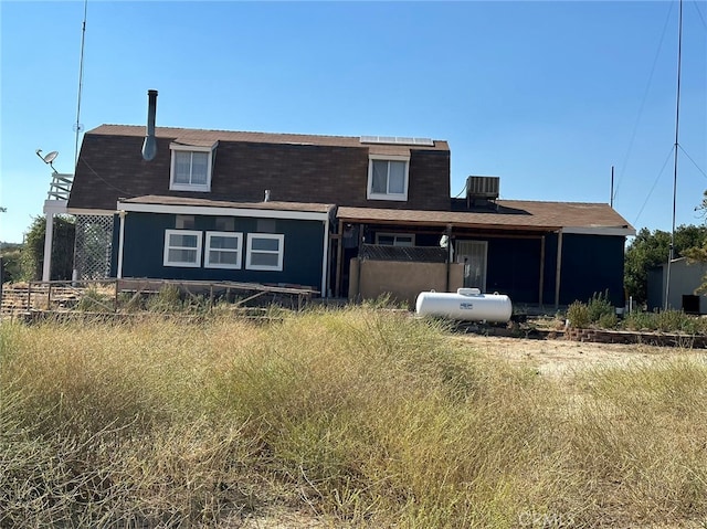 rear view of house with central air condition unit