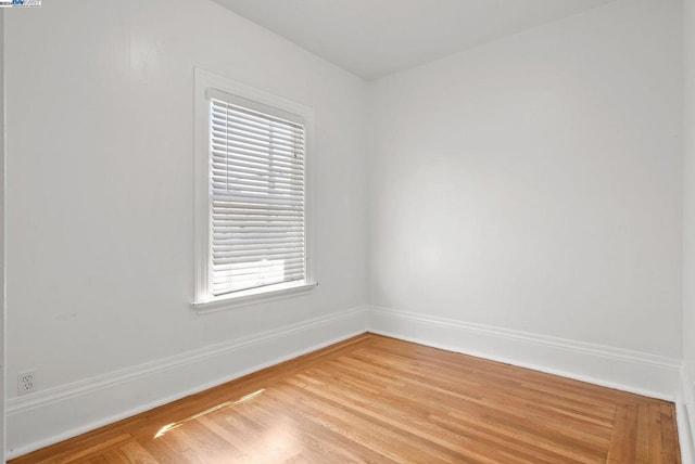 unfurnished room with light hardwood / wood-style floors