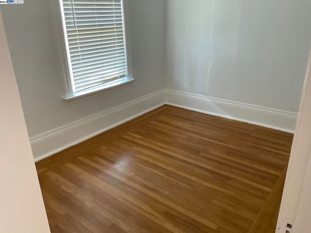 spare room featuring hardwood / wood-style flooring