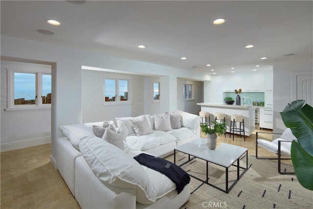 living room with a water view and wine cooler