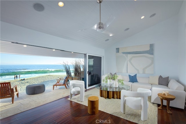 living room with a water view, ceiling fan, wood-type flooring, and vaulted ceiling